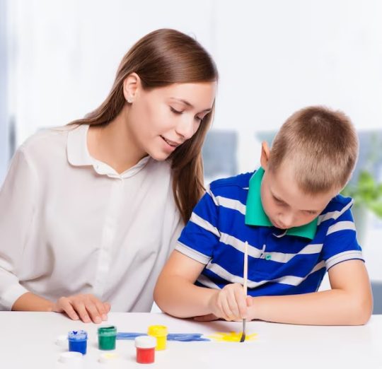 imgi_16_young-mother-sitting-table-home-helping-her-small-son_78203-663
